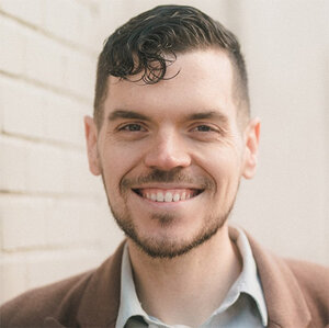 Headshot of Dom Kelly, co-founder and president and CEO of New Disabled South, in a brown jacket. Headshot of Dom Kelly, co-founder and president and CEO of New Disabled South, in a brown jacket.