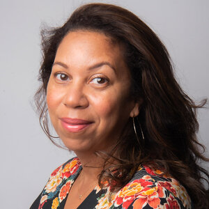 Headshot of Angelique Power, president and CEO of The Skillman Foundation, in a floral print top.
