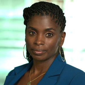 Headshot of Garnesha Ezediaro, Greenwood Initiative Lead, Bloomberg Philanthropies, in a blue suit jacket.