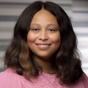 Headshot of TIffany Benjamin, CEO of Humana Foundation, in a pink top.