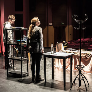 Actors rehearsing on a stage. Actors rehearsing on a stage.
