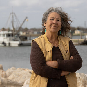Diane Wilson poses on a dock. Diane Wilson poses on a dock.