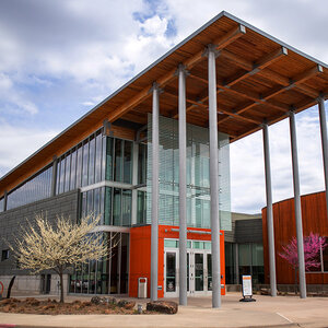 The modern glass façade of a museum.
