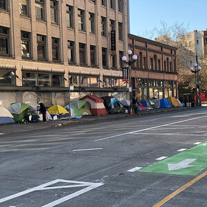 Tents lining a city street. Tents lining a city street.