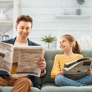 A family reading the news together.