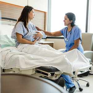 A mother at a doctor's appointment. A mother at a doctor's appointment.