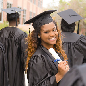 An African American woman wearing a cap and gown.