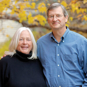 A couple pose for a photo in early autumn – a photo of Barbara and Wally Weitz.