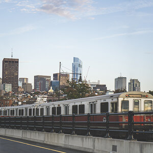 Boston's Red Line going over a bridge with skyline in background. Boston's Red Line going over a bridge with skyline in background.