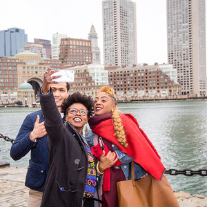 A group taking a selfie in Boston. A group taking a selfie in Boston.