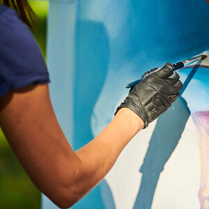 A person painting a picture. A person painting a picture.