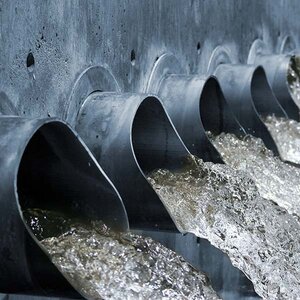 Water gushing out of steel spouts.