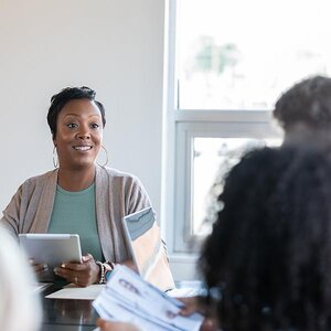 A woman in an organizational meeting.