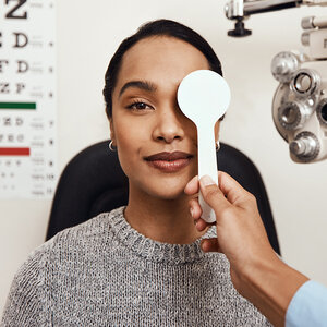 A woman at an eye appointment.