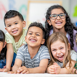 Young schoolchildren with big smiles pose for a photo. Young schoolchildren with big smiles pose for a photo.