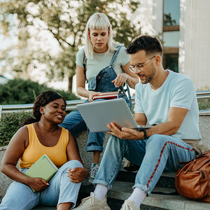 A group of college students studying together. A group of college students studying together.
