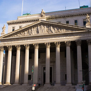 The exterior of a city hall building. The exterior of a city hall building.