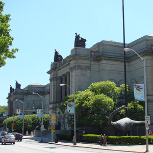 The grand Greek Revival exterior of a museum surrounded by trees—the Carnegie Museum of Natural History. The grand Greek Revival exterior of a museum surrounded by trees—the Carnegie Museum of Natural History.