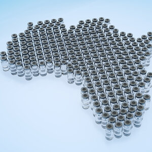 Vaccine vials arranged in the shape of the continent of Africa.
