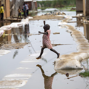 A child plays in the floodwaters in Gatumba, located near Bujumbura in Burundi.