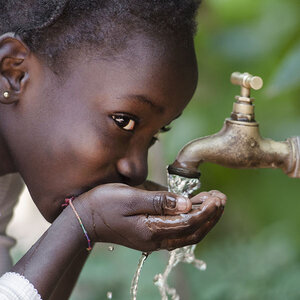 A girl drinking clean water.