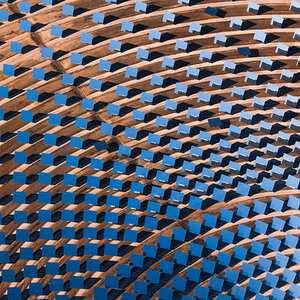 Aerial shot of an array of solar panels.