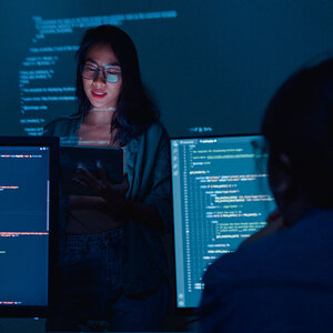 A student researching AI technology in front of a class.