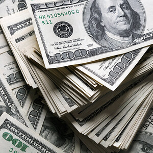 A large pile of one-hundred-dollar bills. A large pile of one-hundred-dollar bills.