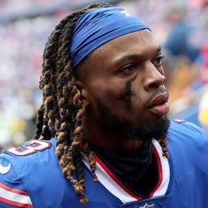 A football player with a beard wearing a blue uniform - an image of Damar Hamlin.