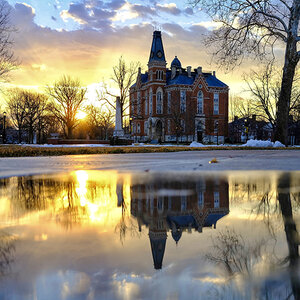 A building on the campus of DePauw University reflects off water soon after dawn. A building on the campus of DePauw University reflects off water soon after dawn.