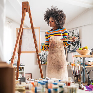 An artist working in her studio.