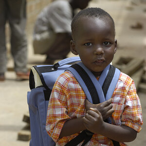 A child in Uganda is prepared to attend school. A child in Uganda is prepared to attend school.