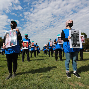 People protesting for the safety of the Uyghur community in China.