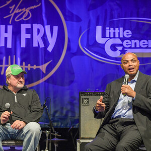 WVU Men’s Basketball Coach Bob Huggins (at left) listens as NBA great Charles Barkley speaks at the 2023 Bob Huggins Fish Fry, presented by Little General Stores.
