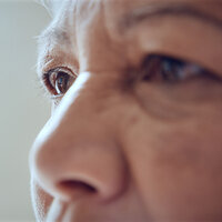 A closeup of an older woman’s face and eyes. A closeup of an older woman’s face and eyes.