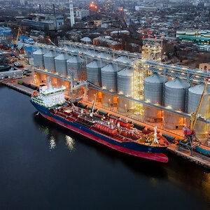 A cargo ship being loaded with grain at a port in Ukraine. A cargo ship being loaded with grain at a port in Ukraine.