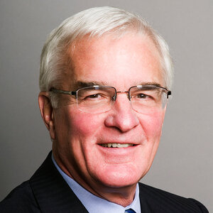 A headshot of a man with light hair wearing glasses – a photo of Ravenel Curry. A headshot of a man with light hair wearing glasses – a photo of Ravenel Curry.