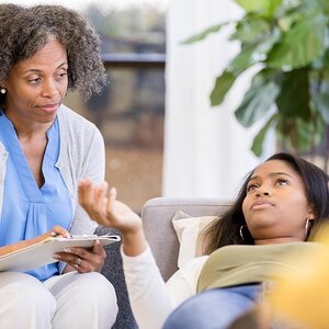 A teen speaking with her therapist.
