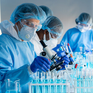 Scientists work on vaccine research projects.
