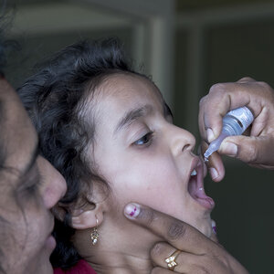 A child receiving oral polio medication A child receiving oral polio medication