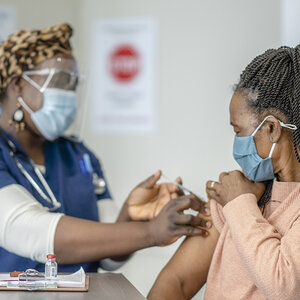 A doctor administering a vaccine.
