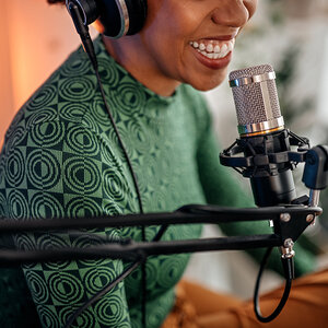 A woman recording a podcast.