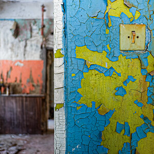 A blue and yellow wall in a damaged building in Ukraine. A blue and yellow wall in a damaged building in Ukraine.