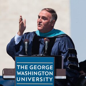 José Andrés in blue robe speaking at The George Washington University's commencement ceremony. José Andrés in blue robe speaking at The George Washington University's commencement ceremony.