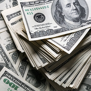 A large pile of one-hundred-dollar bills.