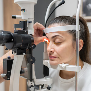 A woman having an eye exam. A woman having an eye exam.