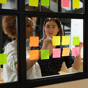 Nonprofit employees working on a whiteboard.