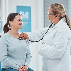 A doctor and patient during a check-up.