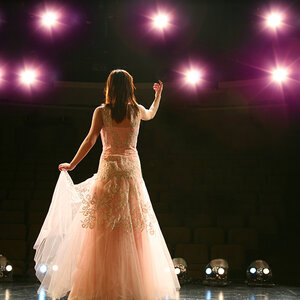 An opera singer performing on stage.