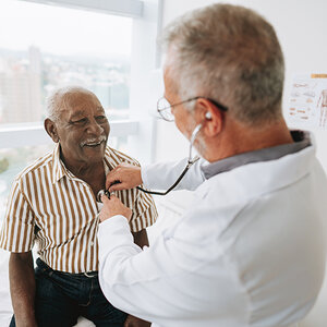 An elderly man getting a checkup at the doctor's office. An elderly man getting a checkup at the doctor's office.
